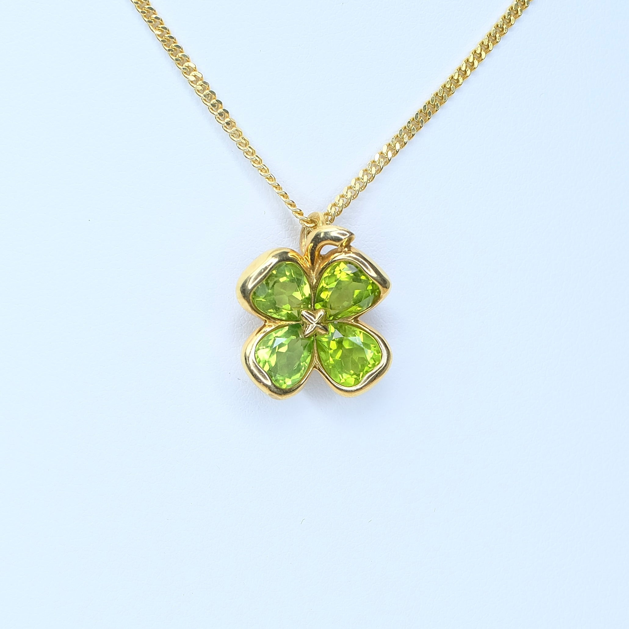 CHANEL 18K YELLOW GOLD PERIDOT CLOVER PENDANT CUBAN CHAIN - Luxuriant Concierge