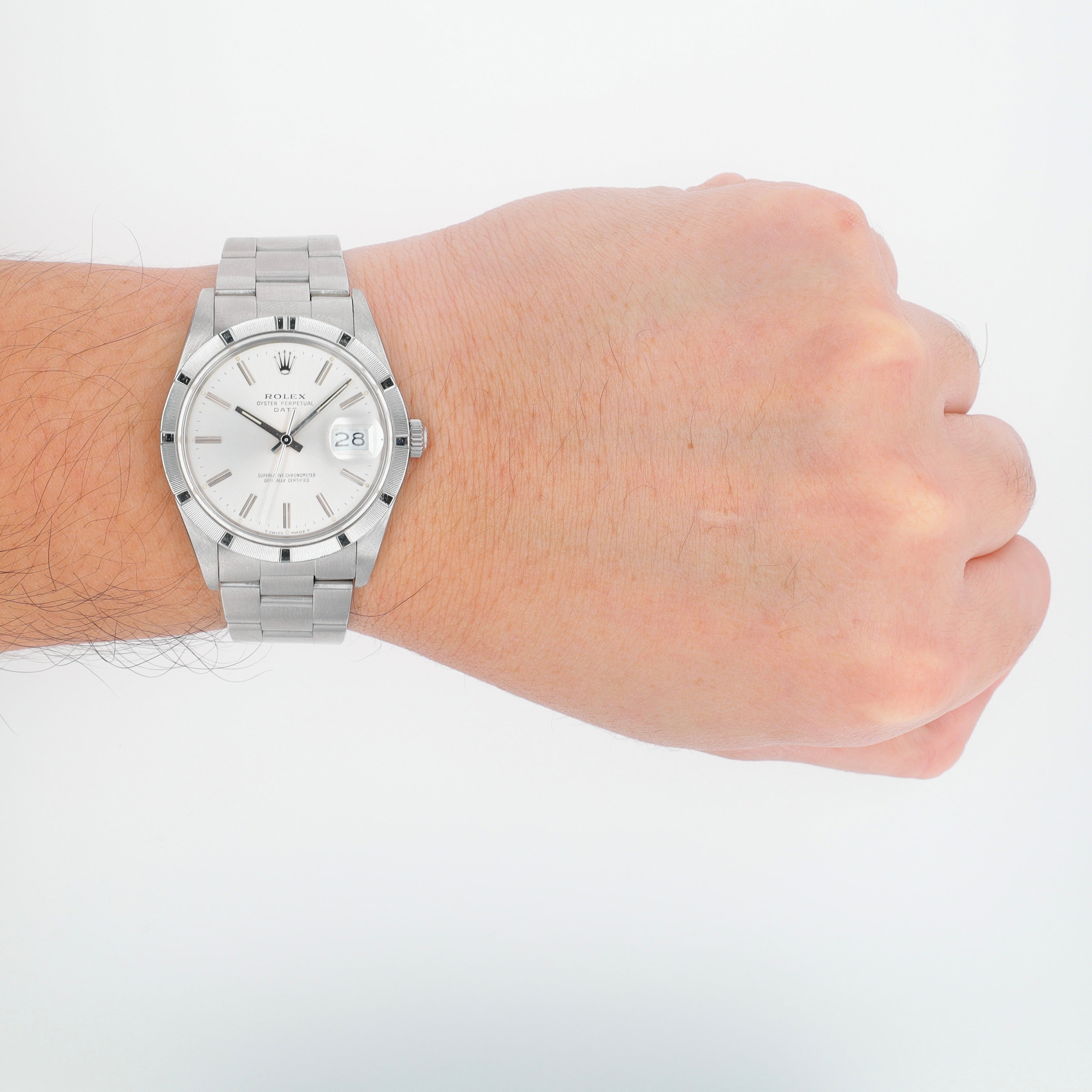 Rolex Date 15010 34mm Silver Index Dial Engine-Turned Bezel Oyster Band - Luxuriant Concierge