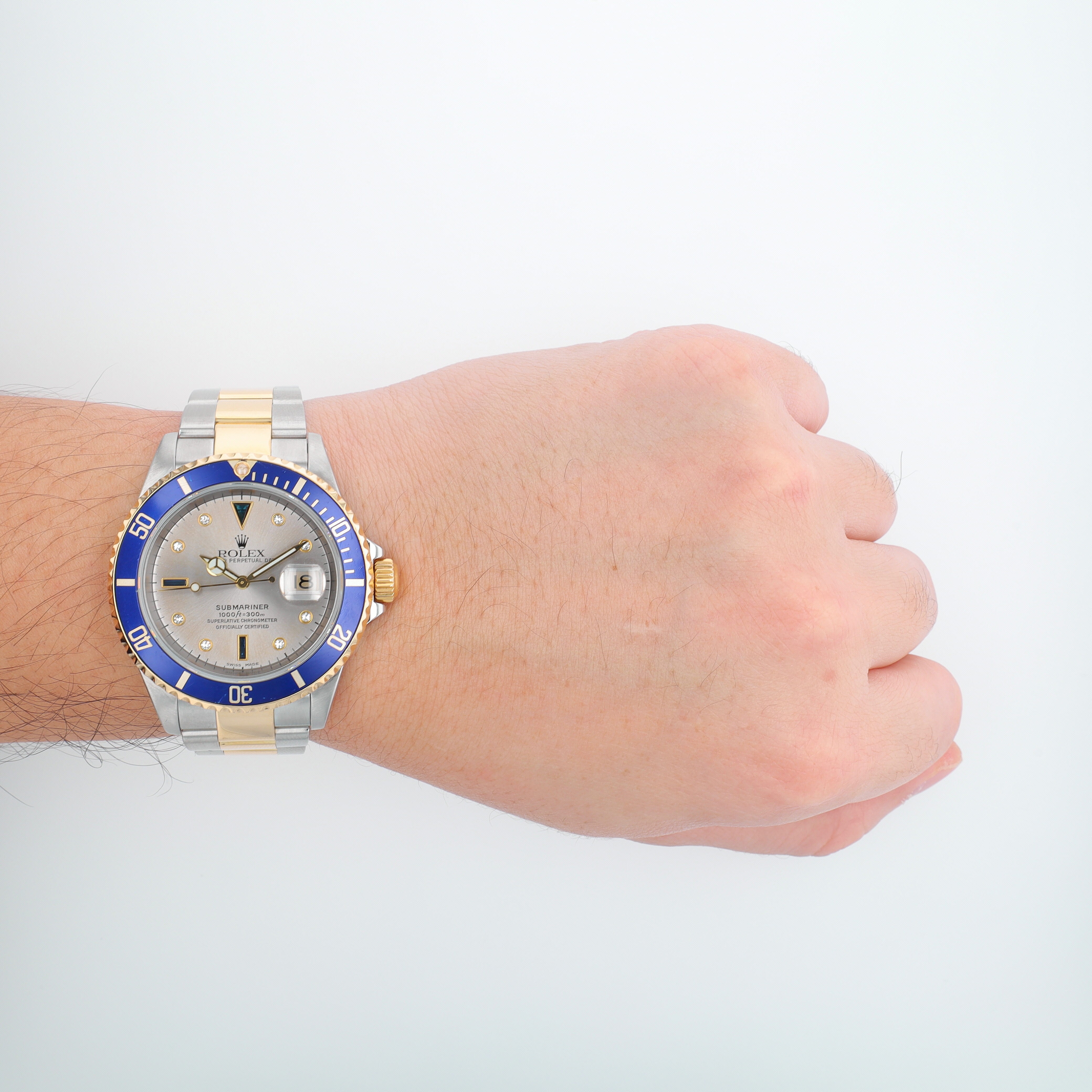 B&P Rolex Submariner 16613 40mm Grey Diamond + 2 baguette Dial Rotatable Bezel with blue Insert Bezel Oyster Band - Luxuriant Concierge