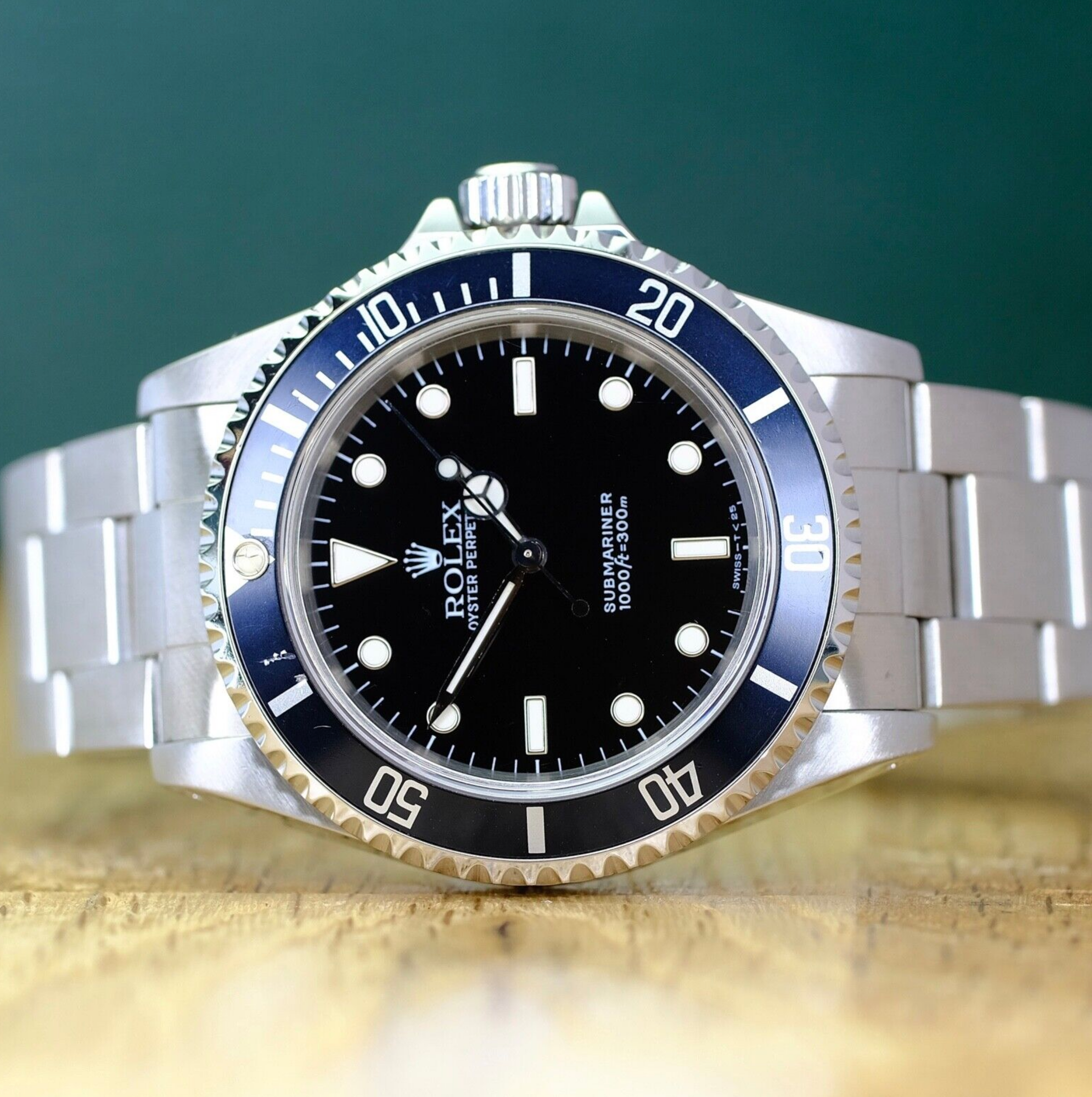 Rolex Mens Submariner Black No-Date 14060 Watch - luxuriantconcierge